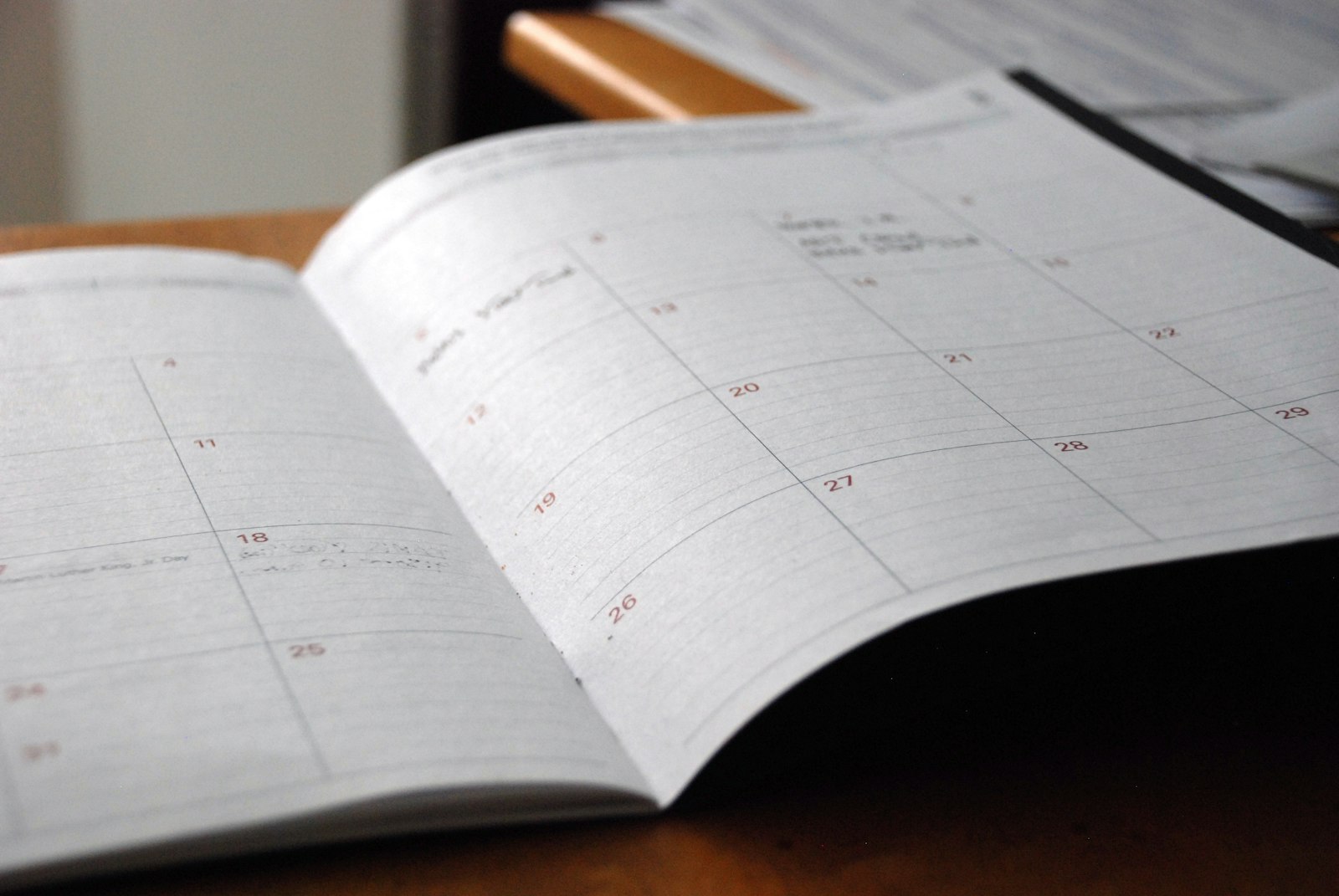 Illustrative photo of an open planner calendar, representing the multi-store activation schedule